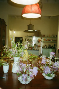 a wooden table with flowers on it